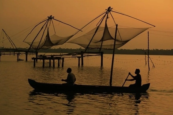 Local men rowing a country boat, near Kumbalangi, Cochin
