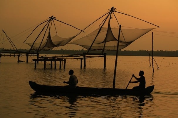 Local men rowing a country boat, near Kumbalangi, Cochin Local men rowing a country boat, near Kumbalangi, Cochin