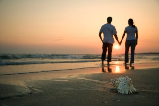 Couple holding hands...walking along the beach! Couple holding hands...walking along the beach!