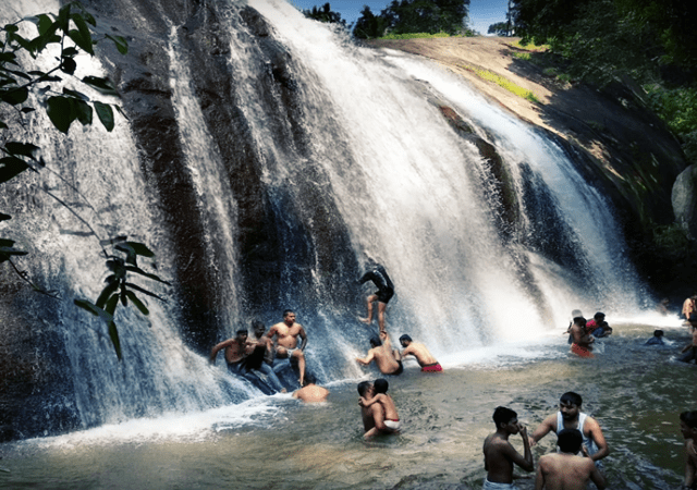 Tourist Enjoying the Waterfall Tourist Enjoying the Waterfall