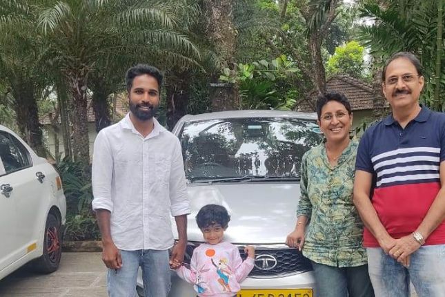 Family traveling in sedan during Kerala road trip – ideal car for Kerala tour