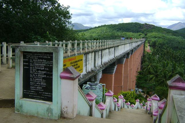 Tourists exploring Mathur Aqueduct in Kanyakumari sightseeing trip